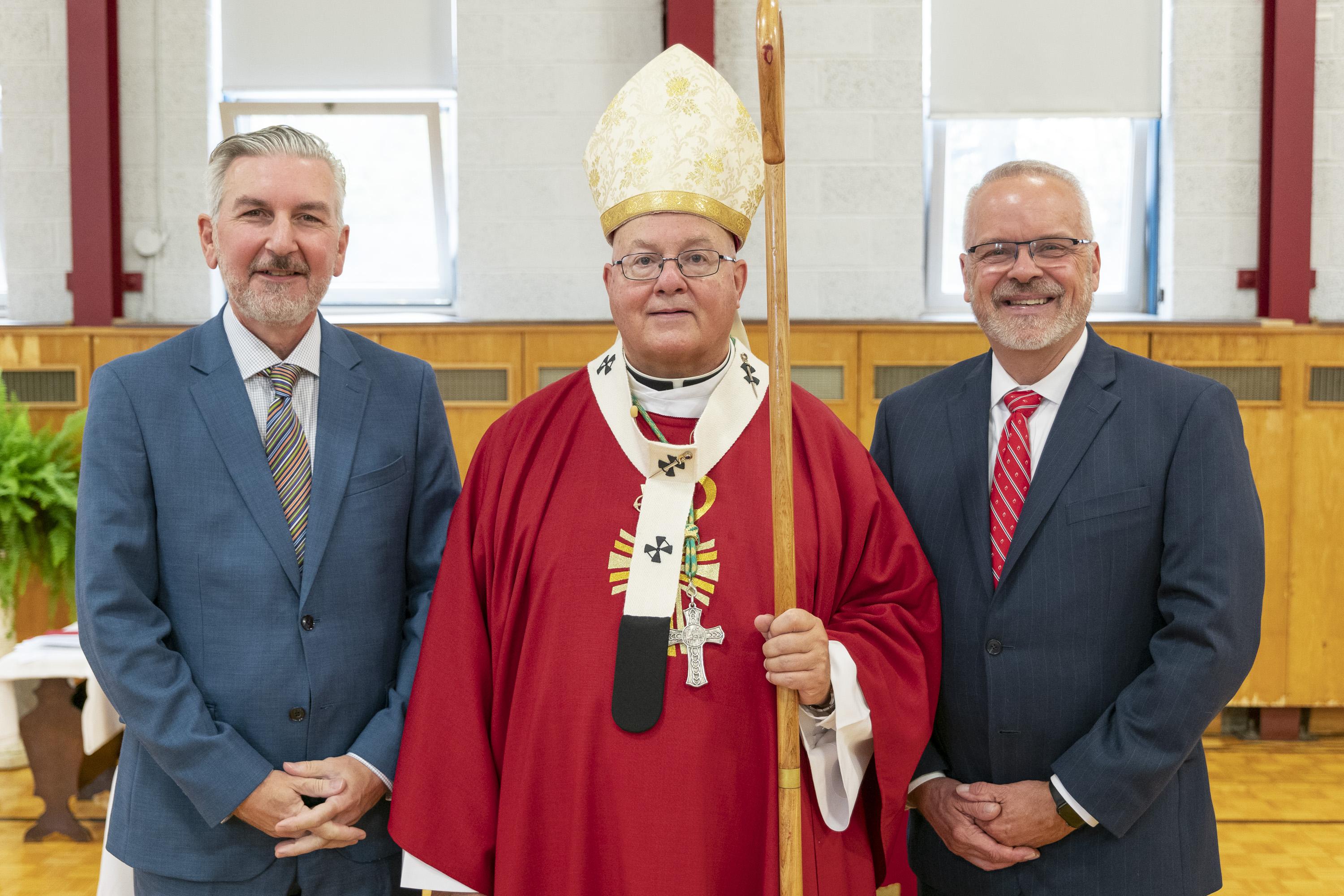 Dennis Philips (left) with Archbishop Brian Joseph Dunn, Archbishop of the Archdiocese of Halifax-Yarmouth, and Nat Wilburn. (Photo courtesy of Sacred Heart School of Halifax)