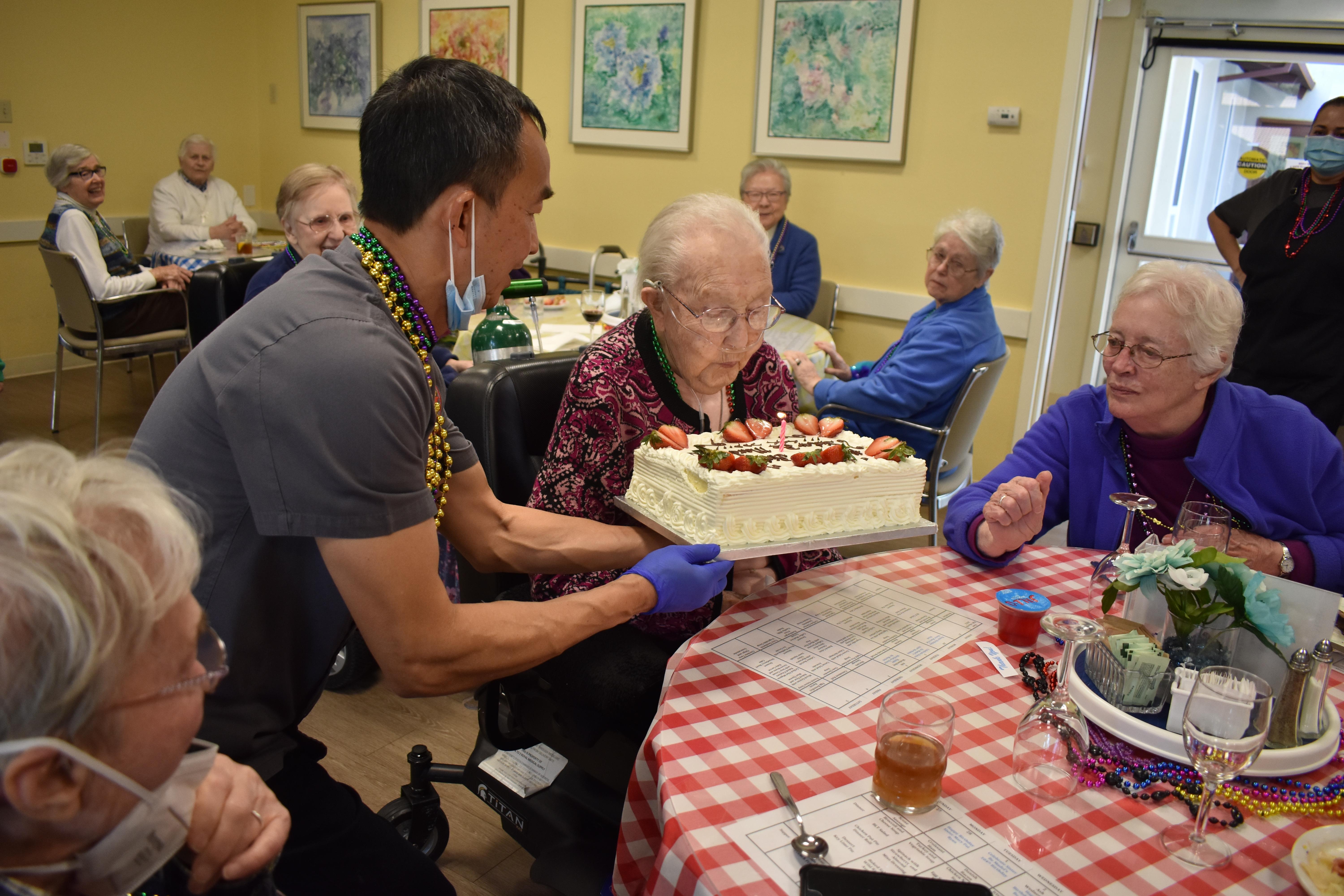The late Sister Mardel celebrating her 104th birthday in March 2022 with  RSCJ and staff at Oakwood.