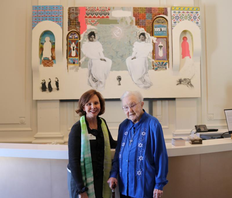 Schools of the Sacred Heart San Francisco President Dr. Ann Marie Krejcarek with Mary "Be" Mardel, RSCJ, standing in front of the art installation titled "Welcome Home" 