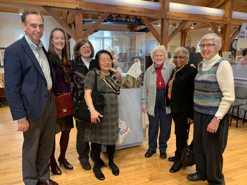 From left to right: Tom Farquhar (Museum Board, Sidwell Friends School Head) Mary Grady (his wife, quilt artist), Susan,  Linda Kato, RSCJ; Calre Pratt, RSCJ; Joan Ewing, RSCJ; Pat Geuting, RSCJ, at the Sandy Spring Museum