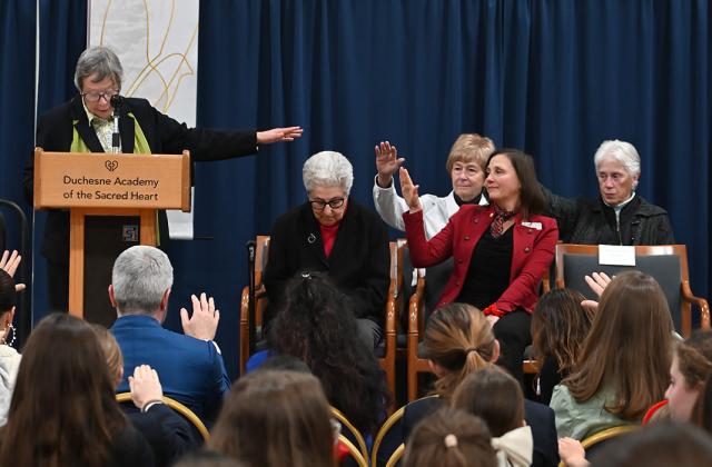 Sister Karam receives a blessing from the Duchesne community.